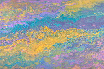 Fototapeta na wymiar Abstract color background from liquid paints close-up