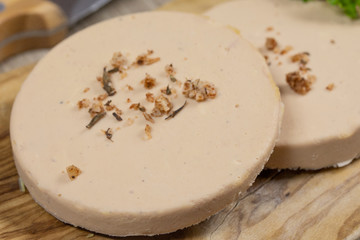  slices of foie gras on a cutting board