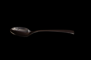 Spoon isolated on a black background