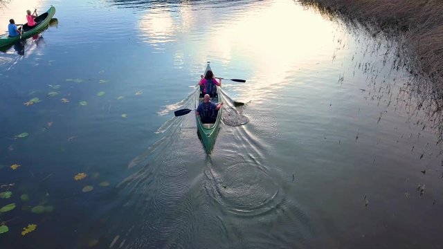 People Enjoying Canoeing Adventure in Kras Lake - Medium Shot