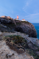 Naklejka premium View of the lighthouse and cliffs at Cape St. Vincent at sunset. Continental Europe's most South-western point, Sagres, Algarve, Portugal.