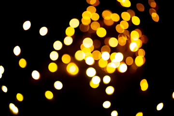 Golden sparkles raster festive background. Bokeh lights with bright shiny effect illustration....