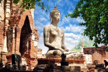 peaceful sitting Buddha statue at Wat Mahathat, one of the most important temples in the Ayutthaya, Thailand