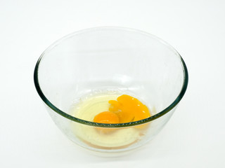 Broken eggs in a deep transparent plate. Dough for pancakes. Cooking food