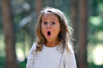 4 year old girl makes a funny face
