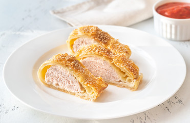 Sausage rolls with tomato sauce