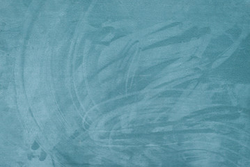 abstract blue surface of the wall / background with irregularities and stains of different colors