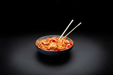 lobster with shrimp in a plate on a black background