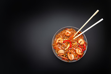 lobster with shrimp in a plate on a black background