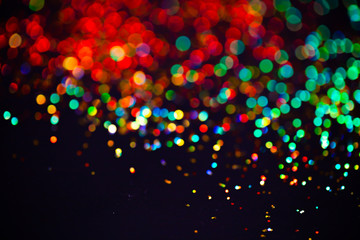 Multicolor glitter raster background. Abstract shimmering red circles on deep purple backdrop....
