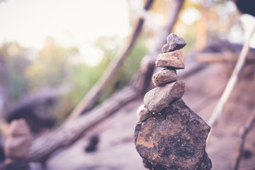 Zen Stones or Pyramid of stones on the beach. Blurred background.