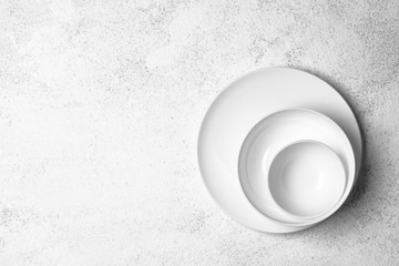 White plates isolated on a light background. Table setting. Top view copy space.