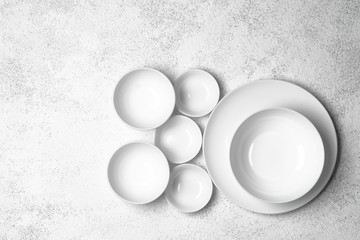 White plates isolated on a light background. Table setting. Top view copy space.