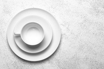 White plates isolated on a light background. Table setting. Top view copy space.