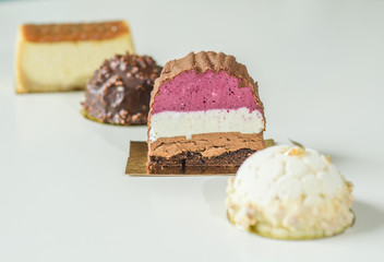 Different delicious and beautiful cakes on the table in a cozy coffee shop