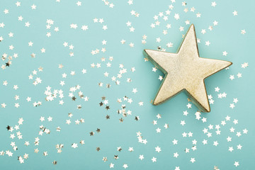 Christmas composition. Christmas golden glittering decorations on color background. Flat lay, top view, copy space - Image