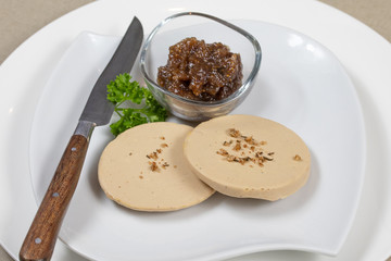 slices of foie gras on a plate