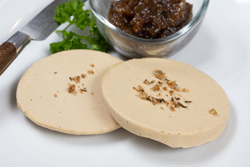 slices of foie gras on a plate