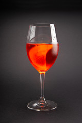 glass of wine in the studio on a gray background