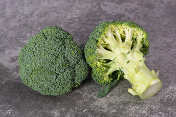 Fresh brocoli on a grey structured background, close-up