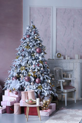 merry christmas card with christmas tree toys decoration presents close up photo on in pink room