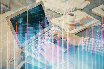 Double exposure of forex graph with man working on computer on background. Concept of market analysis.