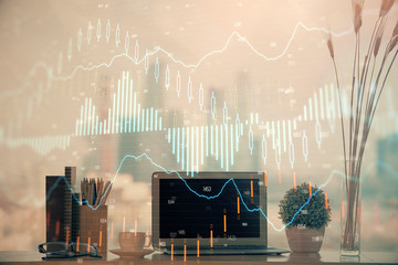 Forex market graph hologram and personal computer on background. Double exposure. Concept of...