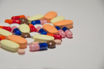 A lot of pills. A medicine for a sick person.