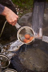 Hot spring with strainer for boiling egg