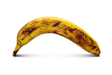 One overripe banana. Yellow banana isolated on a white background.