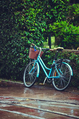 Fototapeta na wymiar Old bicycle under the rain