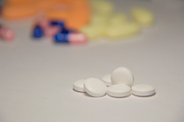A lot of pills. A medicine for a sick person.