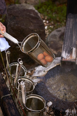 Hot spring with strainer for boiling egg