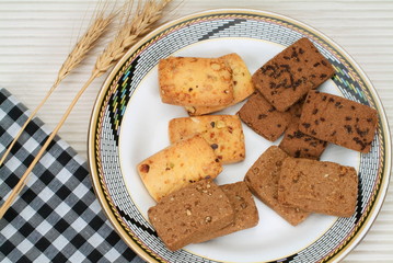 Pista Badam Biscuits kept on a plate.