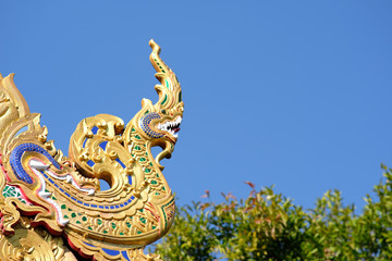 Fototapeta na wymiar dragon on roof of temple in thailand