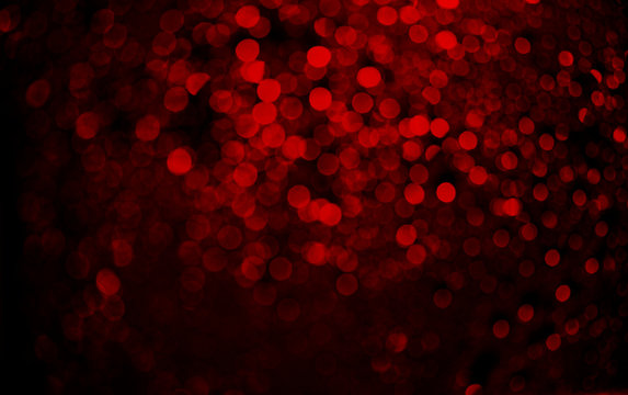 Abstract blur red glitter background card for Valentine's day, christmas and wedding celebration. Love bokeh sparkle confetti textured layout.