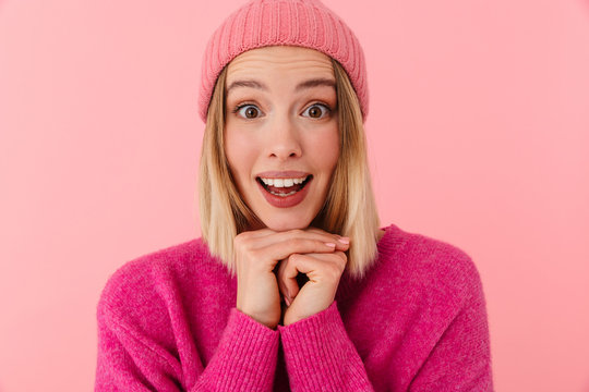 Image of blonde girl wearing hat expressing excitement and wonder