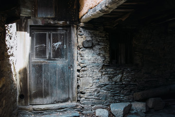 Fototapeta na wymiar Ancient door in a stone wall
