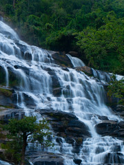 Obraz premium Mae ya waterfall with moss and rocks located in Chiang mai, Thailand.
