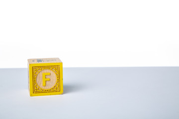 Childrens Wooden Alphabet Block Showing the Letter F