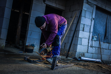Worker With Grinder Cut Iron 