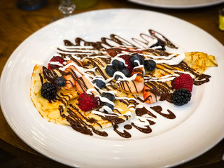 delicious home made pancakes with fresh fruits & chocolate glaze