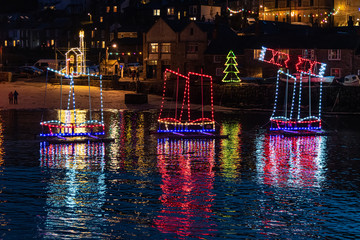 Christmas lights in a harbour in Cornwall