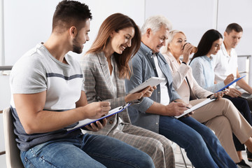 People waiting for job interview in office