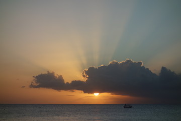 Beautiful crimson red sunset from the beach over the Caribbean Sea in Barbados, Atlantic Ocean