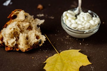Cottage cheese, bread and leaf.