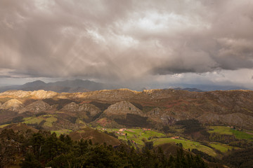 Spectacular views of the Sierra del Sueve (Asturias), photographed from the Mirador del Fitu in Asturias, taking advantage of a stormy day with real rainbow photographed over the mountains