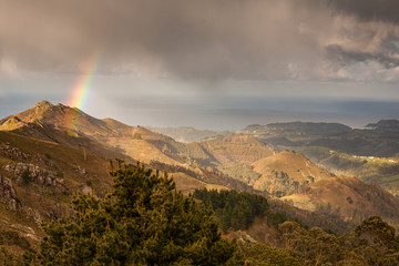 Spectacular views of the Sierra del Sueve (Asturias), photographed from the Mirador del Fitu in Asturias, taking advantage of a stormy day with real rainbow photographed over the mountains