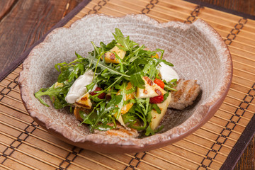 Salad with arugula and roast pork