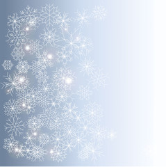Winter background with gradient in blue color and white shiny snowflakes in classic style and place for message	